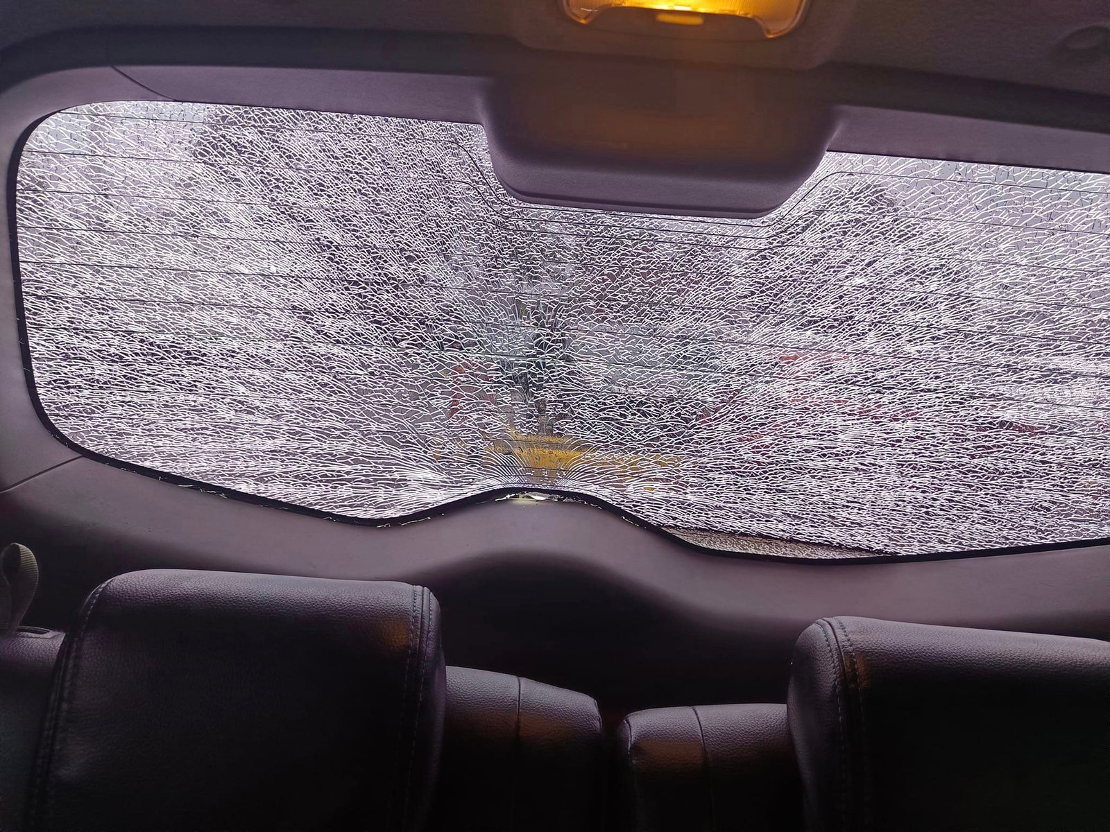 What causes a straight line crack in the windshield?